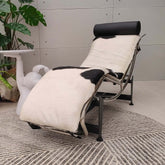 Adjustable chaise chair with curved steel frame, modern design for comfortable seating